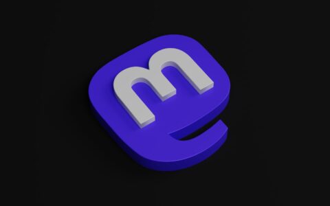 a blue and white m logo on a black background